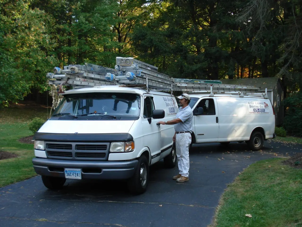 Rick with the company painting vans